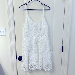 Lacy white dress. New with tags! Never worn. Perfect bridal shower dress!